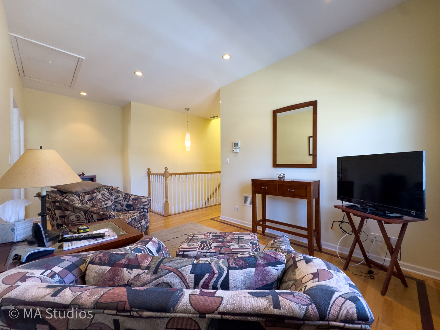 8912 Harms Road Morton Grove, IL 60053 - Photo 51 of 85 a living room with furniture and a flat screen tv