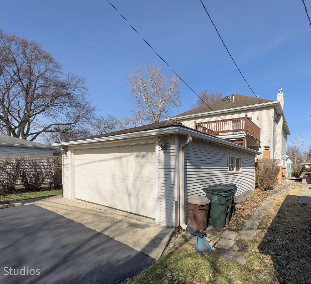 8912 Harms Road Morton Grove, IL 60053 - Photo 74 of 85 a front view of a house with a yard and garage
