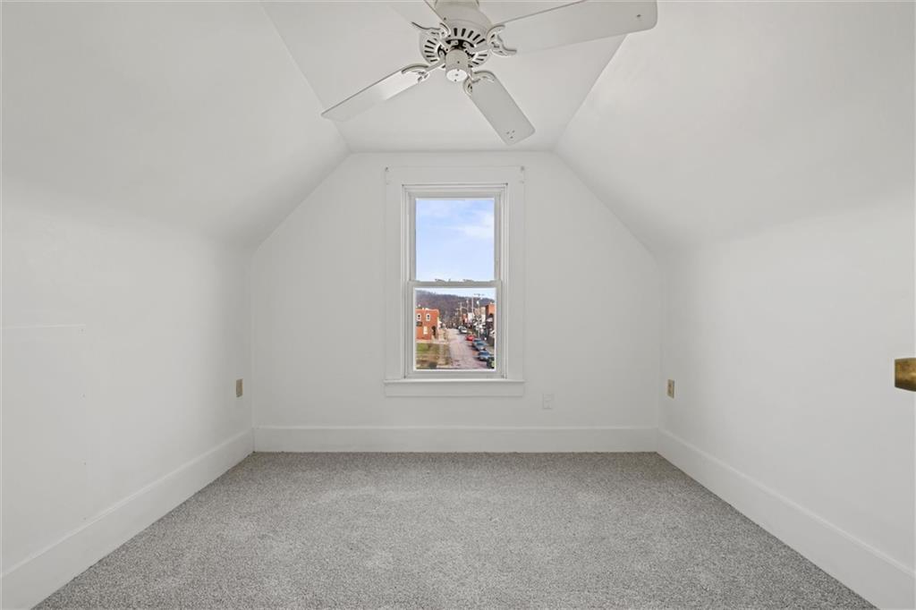 325 Walnut Street Vandergrift, PA 15690 - Photo 21 of 29 an empty room with a window and a ceiling fan
