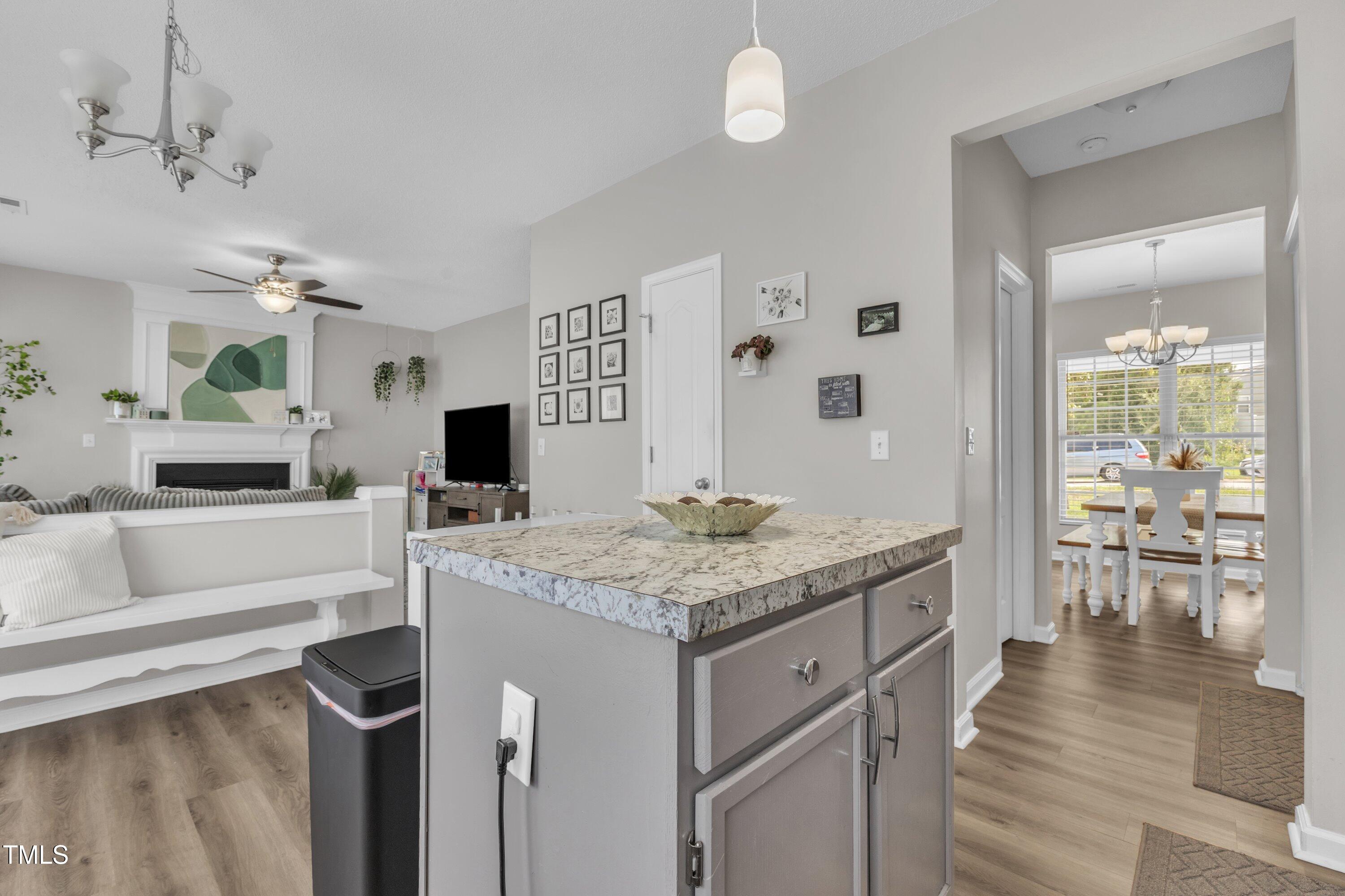 4105 Crowfield Drive Raleigh, NC 27610 - Photo 16 of 38 a bathroom with a granite countertop sink a mirror and a bathtub