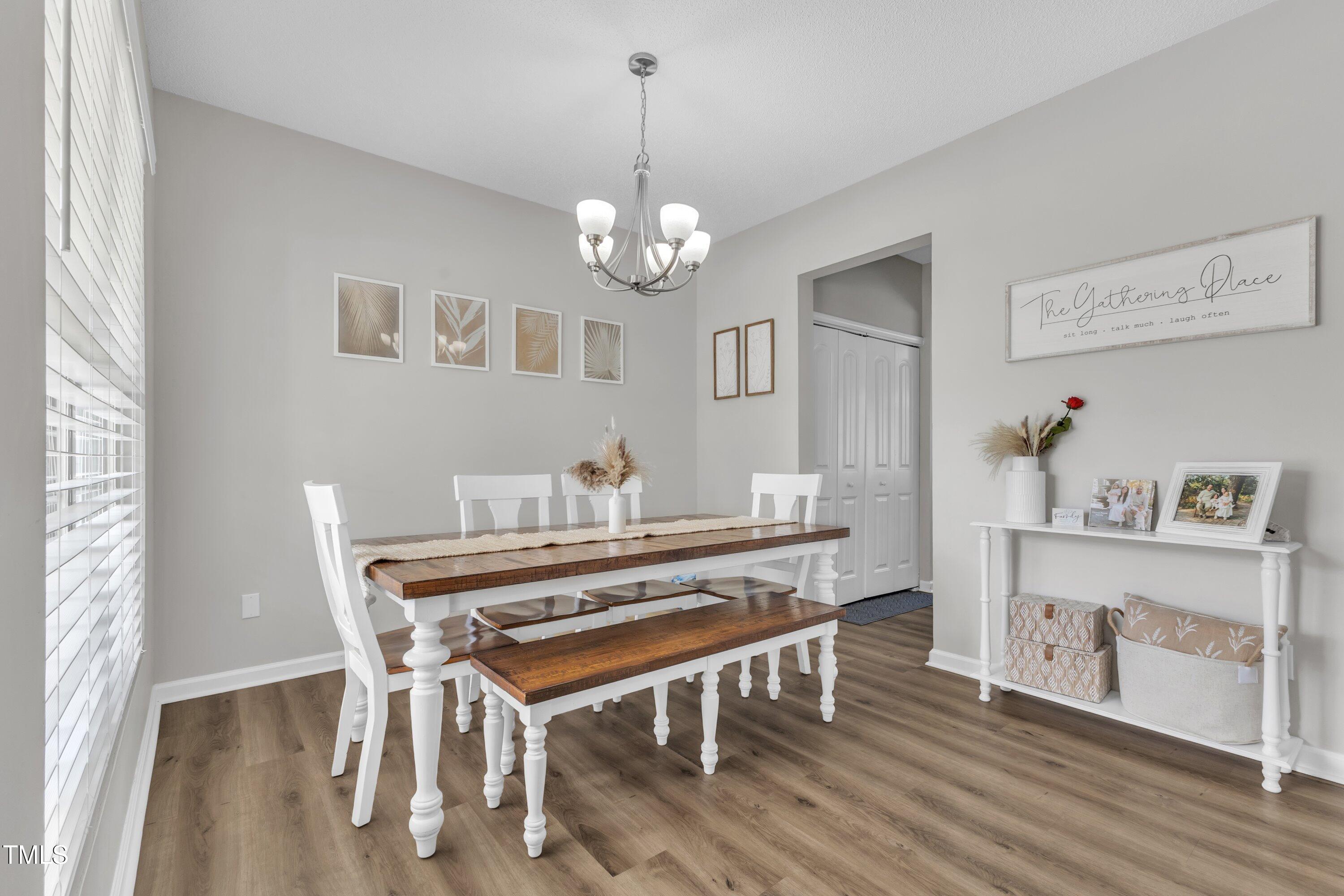 4105 Crowfield Drive Raleigh, NC 27610 - Photo 21 of 38 a view of a dining room with furniture and wooden floor