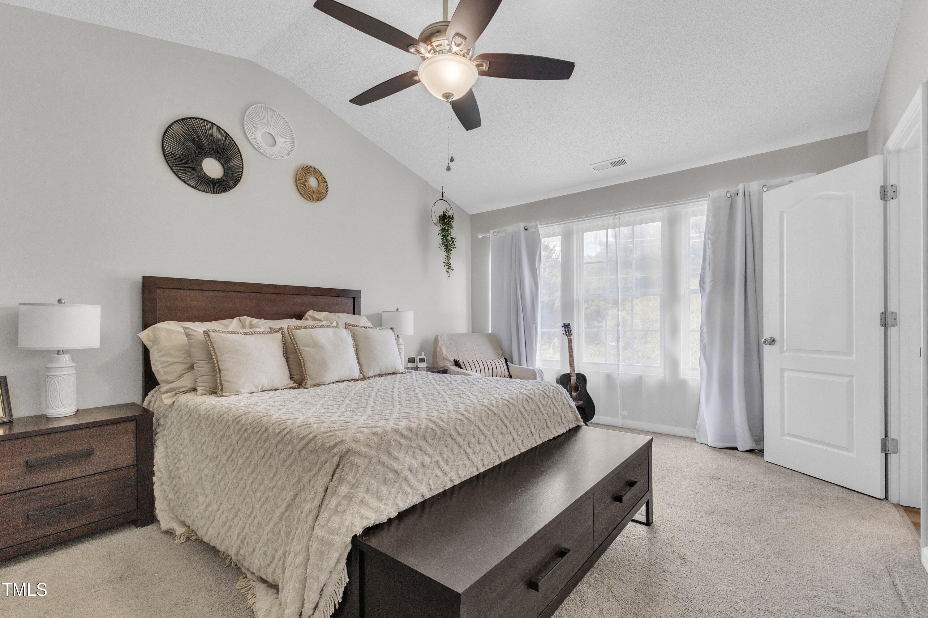 4105 Crowfield Drive Raleigh, NC 27610 - Photo 24 of 38 a bedroom with bed and window