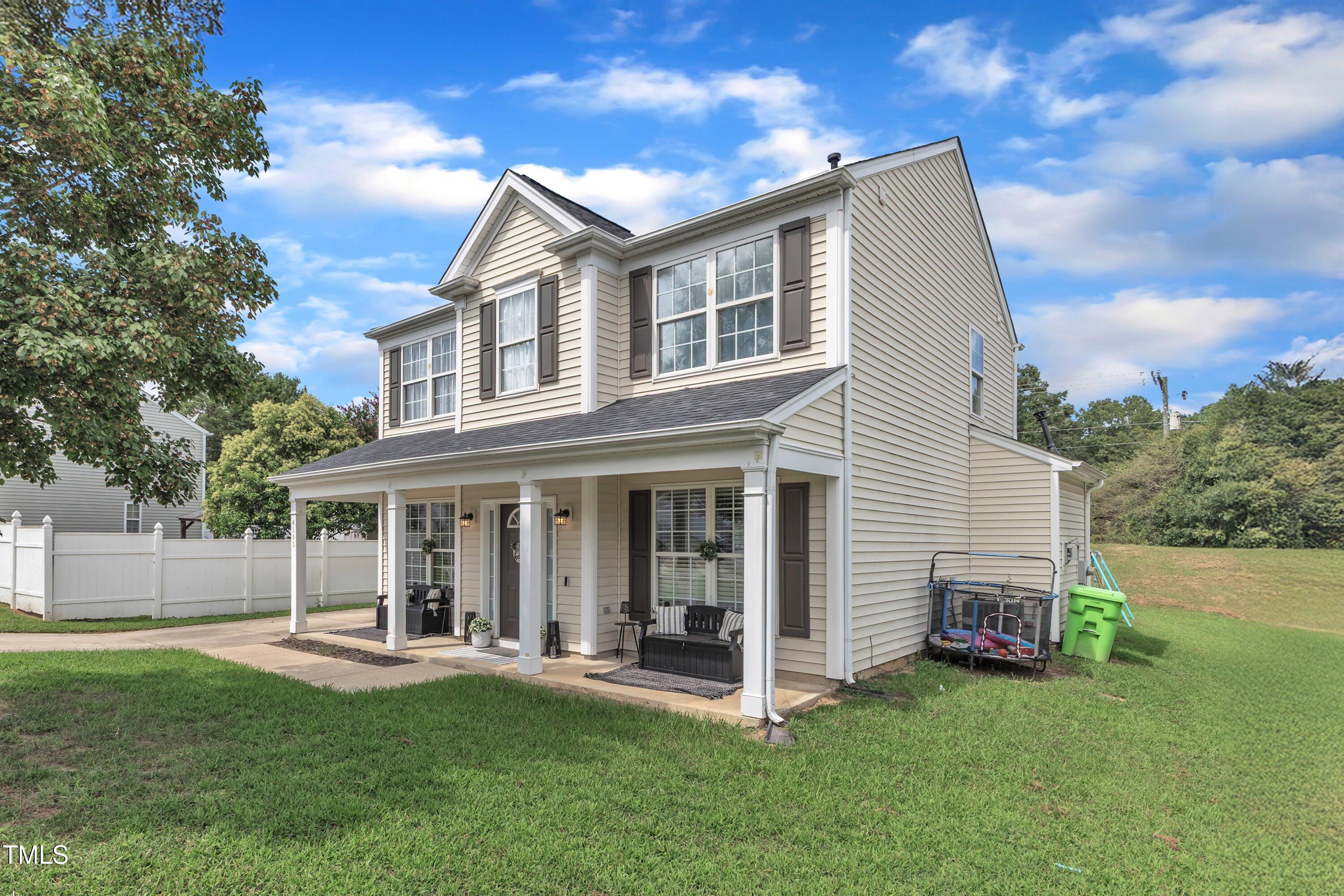 4105 Crowfield Drive Raleigh, NC 27610 - Photo 2 of 38 a view of a house with a yard and sitting area