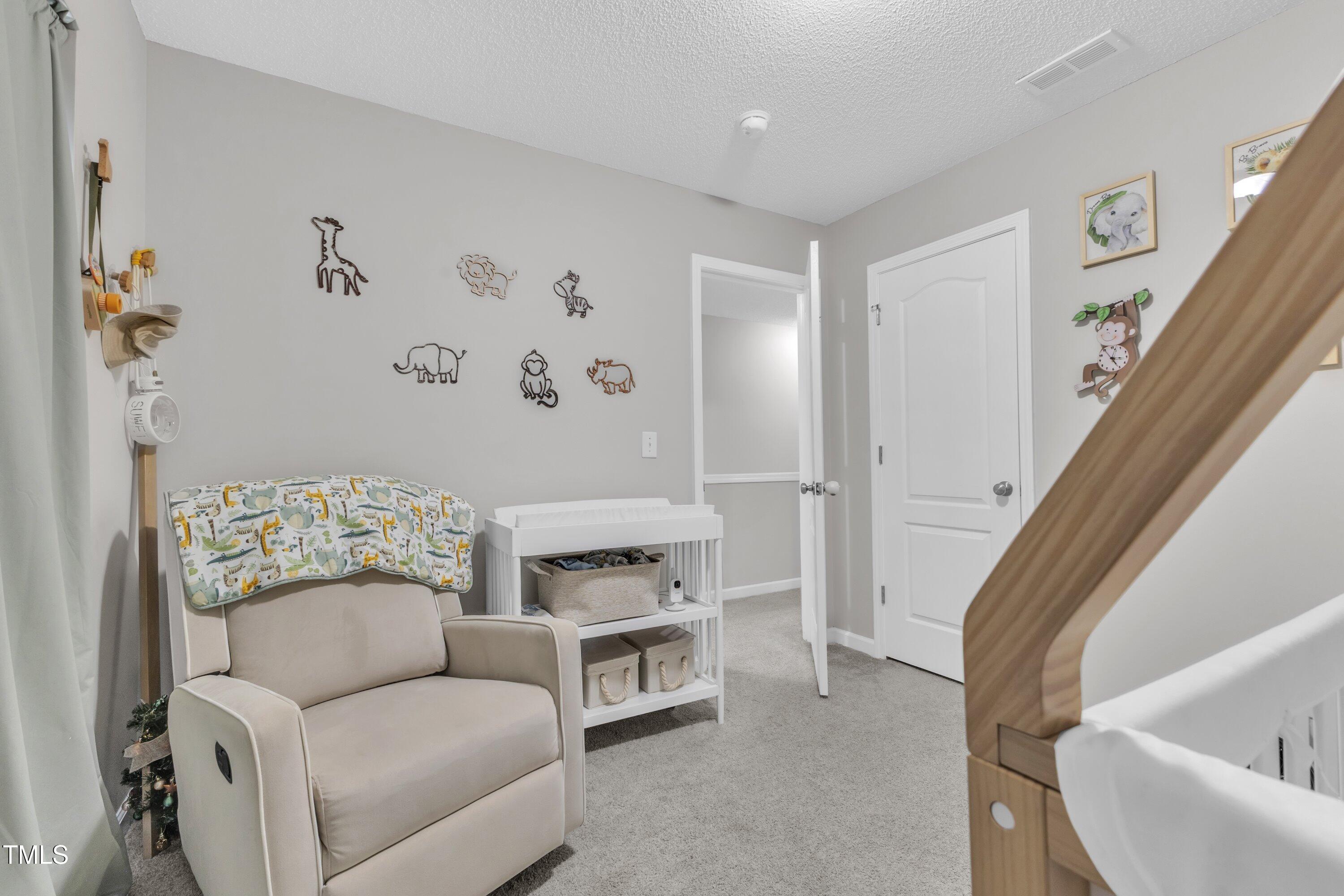 4105 Crowfield Drive Raleigh, NC 27610 - Photo 30 of 38 a living room with furniture and a fireplace