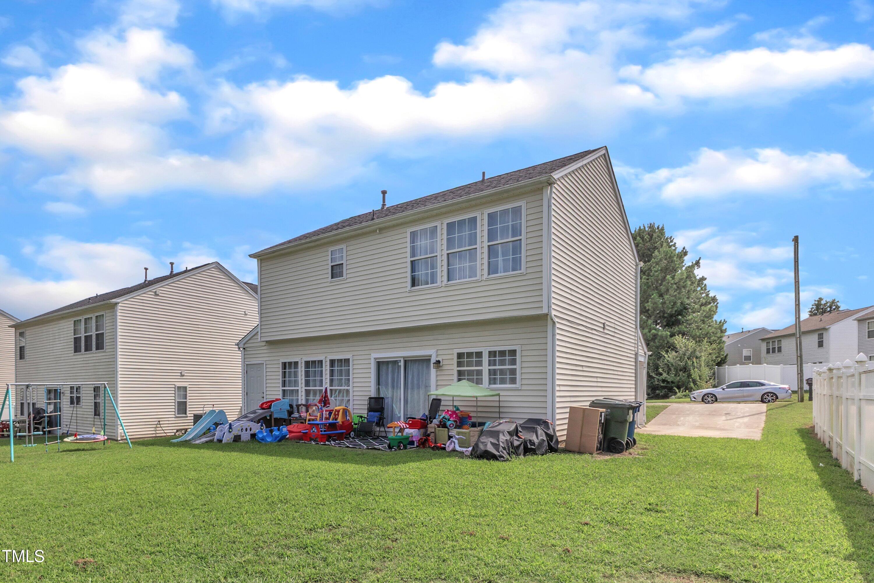 4105 Crowfield Drive Raleigh, NC 27610 - Photo 34 of 38 a view of a house with a yard