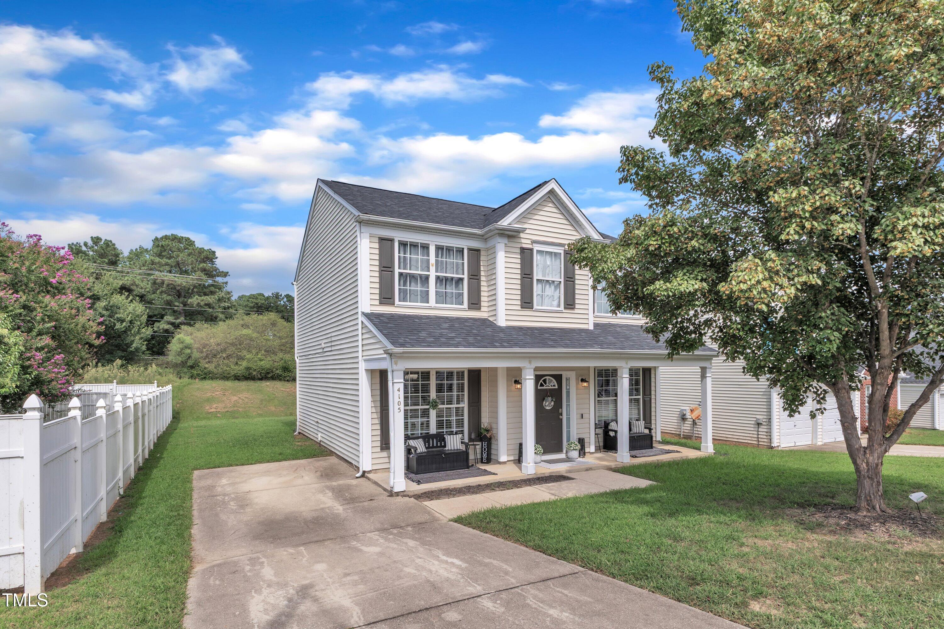 4105 Crowfield Drive Raleigh, NC 27610 - Photo 4 of 38 a front view of a house with a yard
