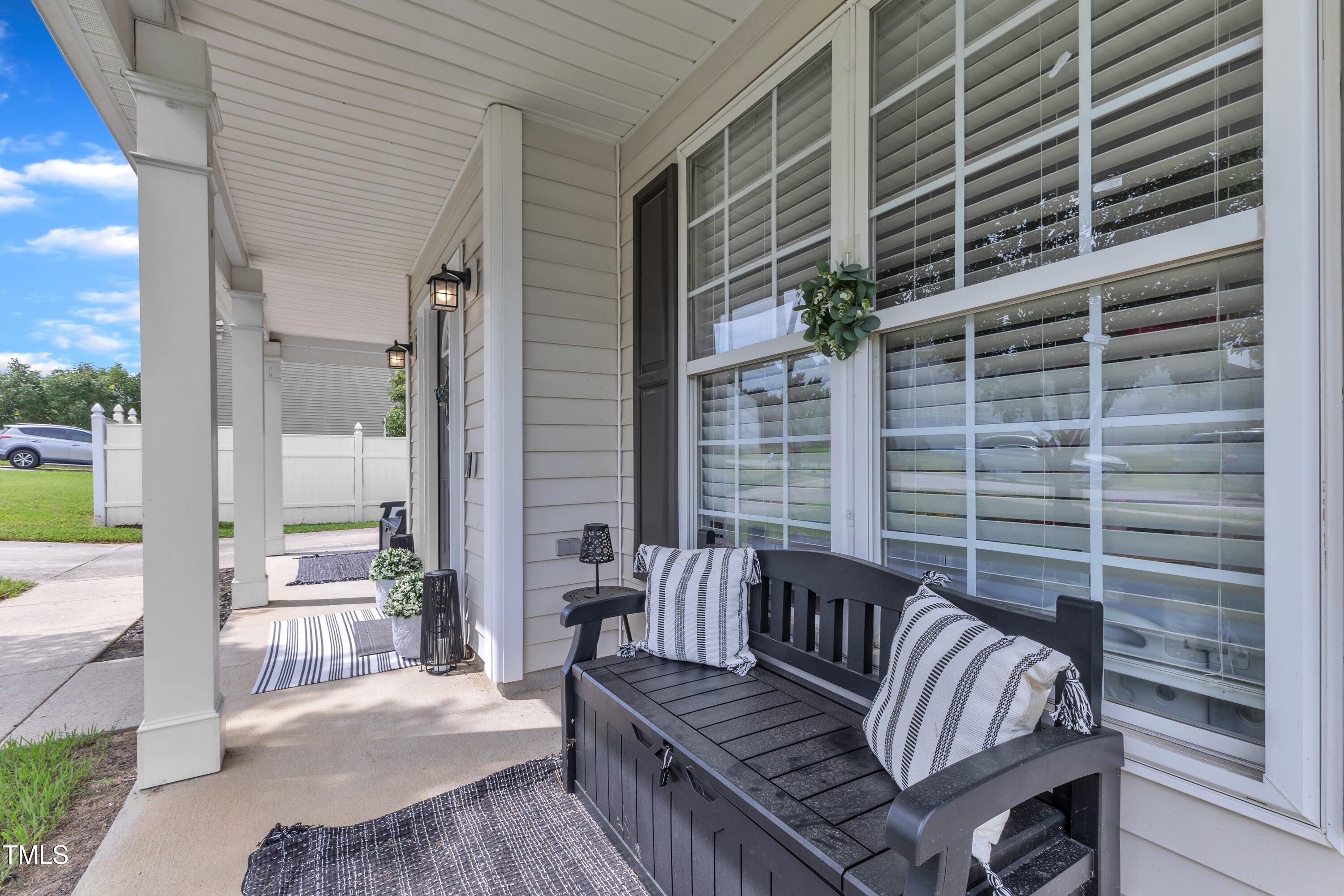 4105 Crowfield Drive Raleigh, NC 27610 - Photo 6 of 38 a view of balcony with two chairs and a potted plant