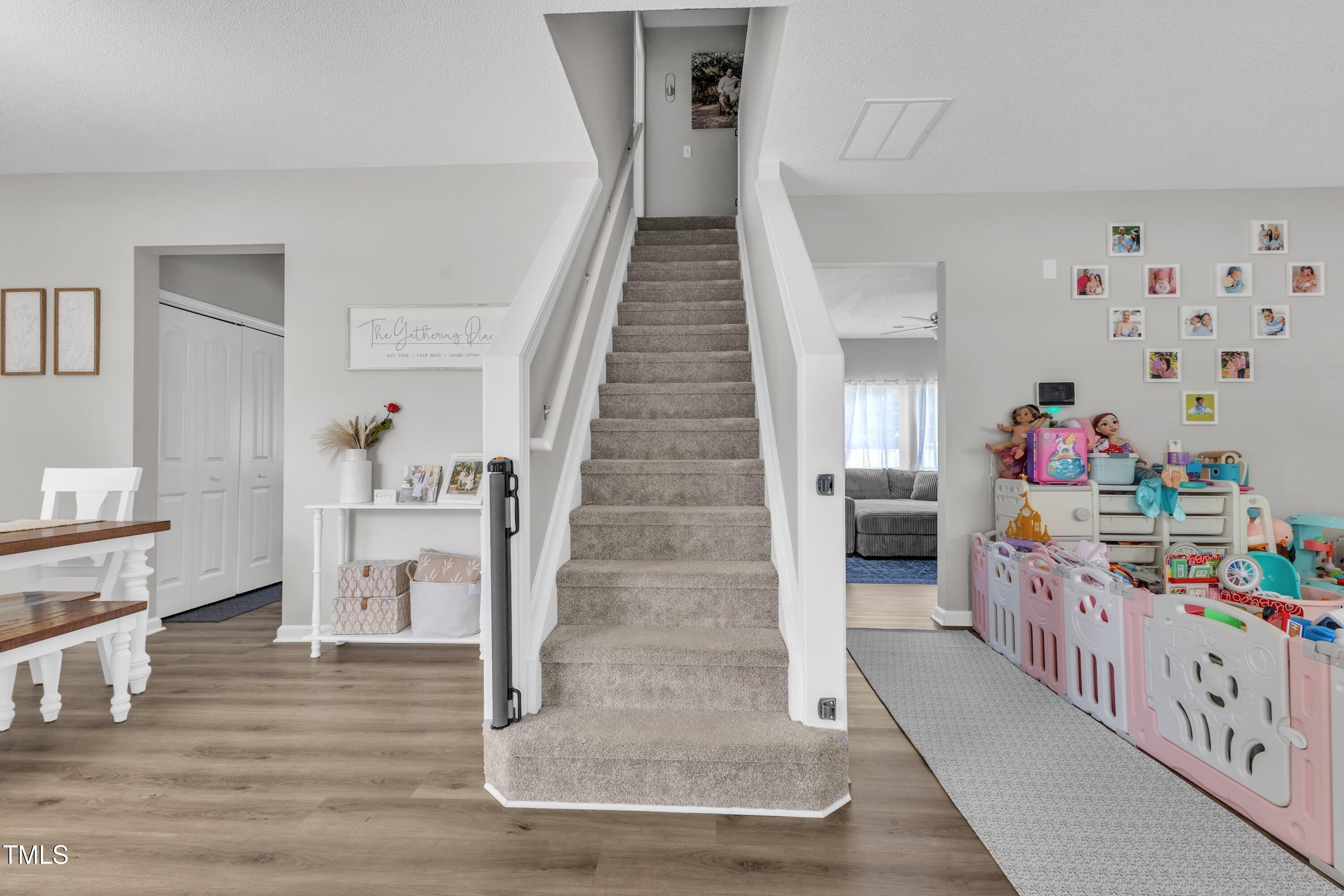 4105 Crowfield Drive Raleigh, NC 27610 - Photo 7 of 38 a view of entryway with furniture and wooden floor