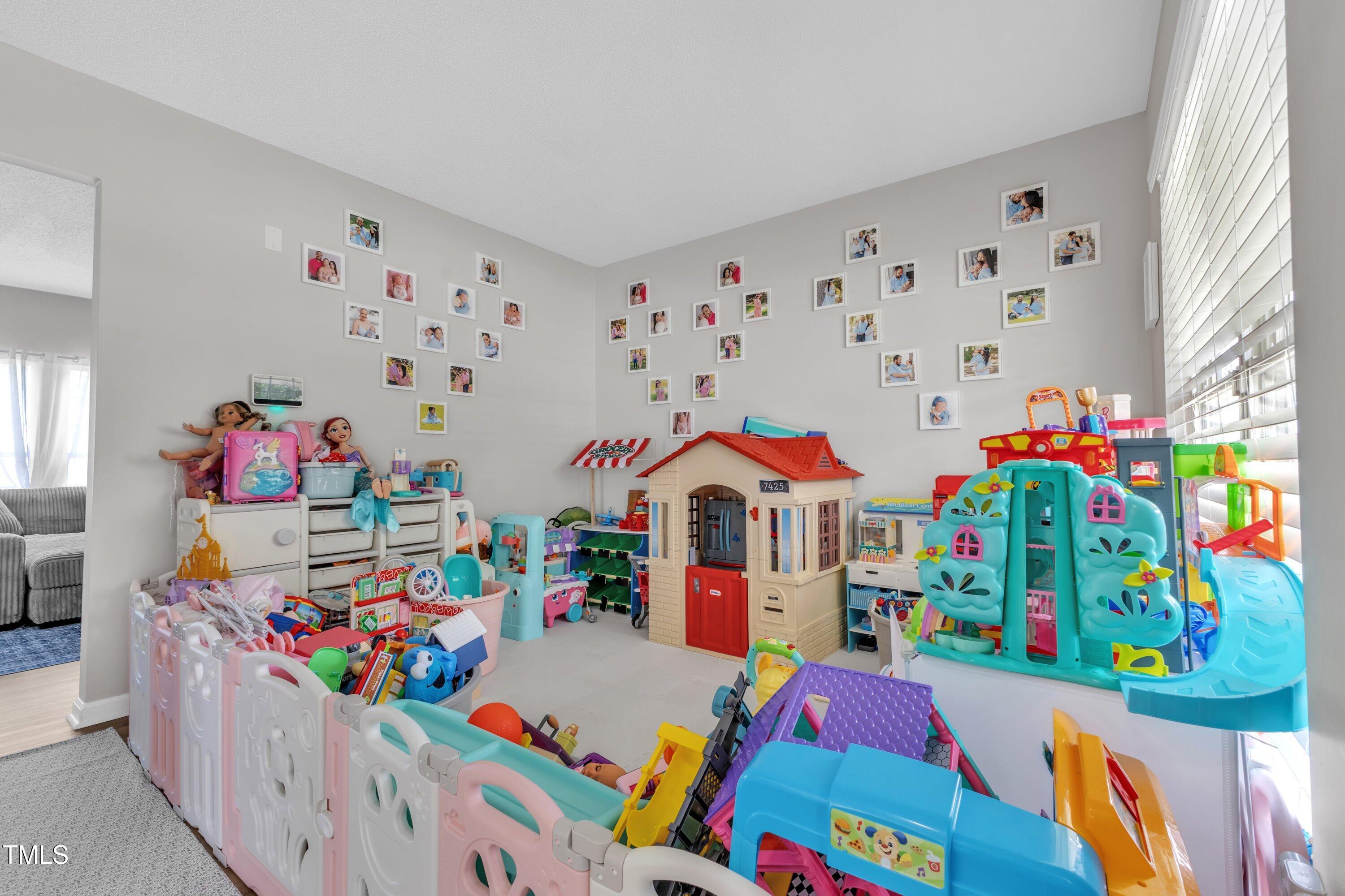 4105 Crowfield Drive Raleigh, NC 27610 - Photo 9 of 38 a room with toys and a book shelf