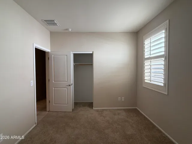 a view of empty room with windows