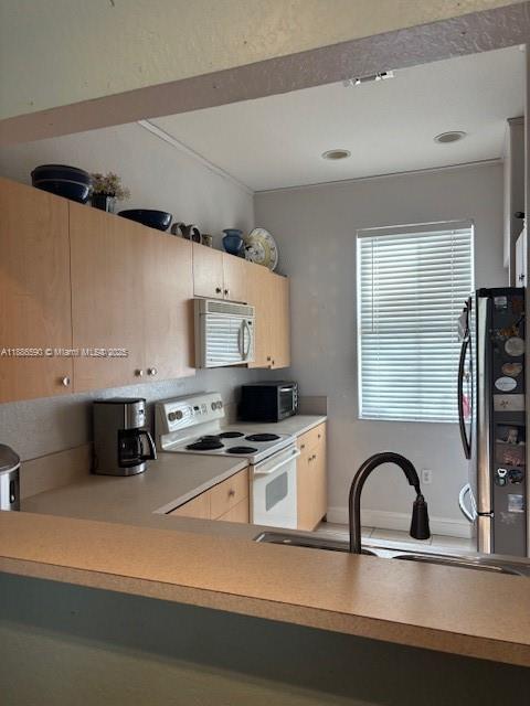23731 Southwest 110th Avenue Homestead, FL 33032 - Photo 3 of 12 a view of kitchen with stainless steel appliances granite countertop a sink a stove and a refrigerator