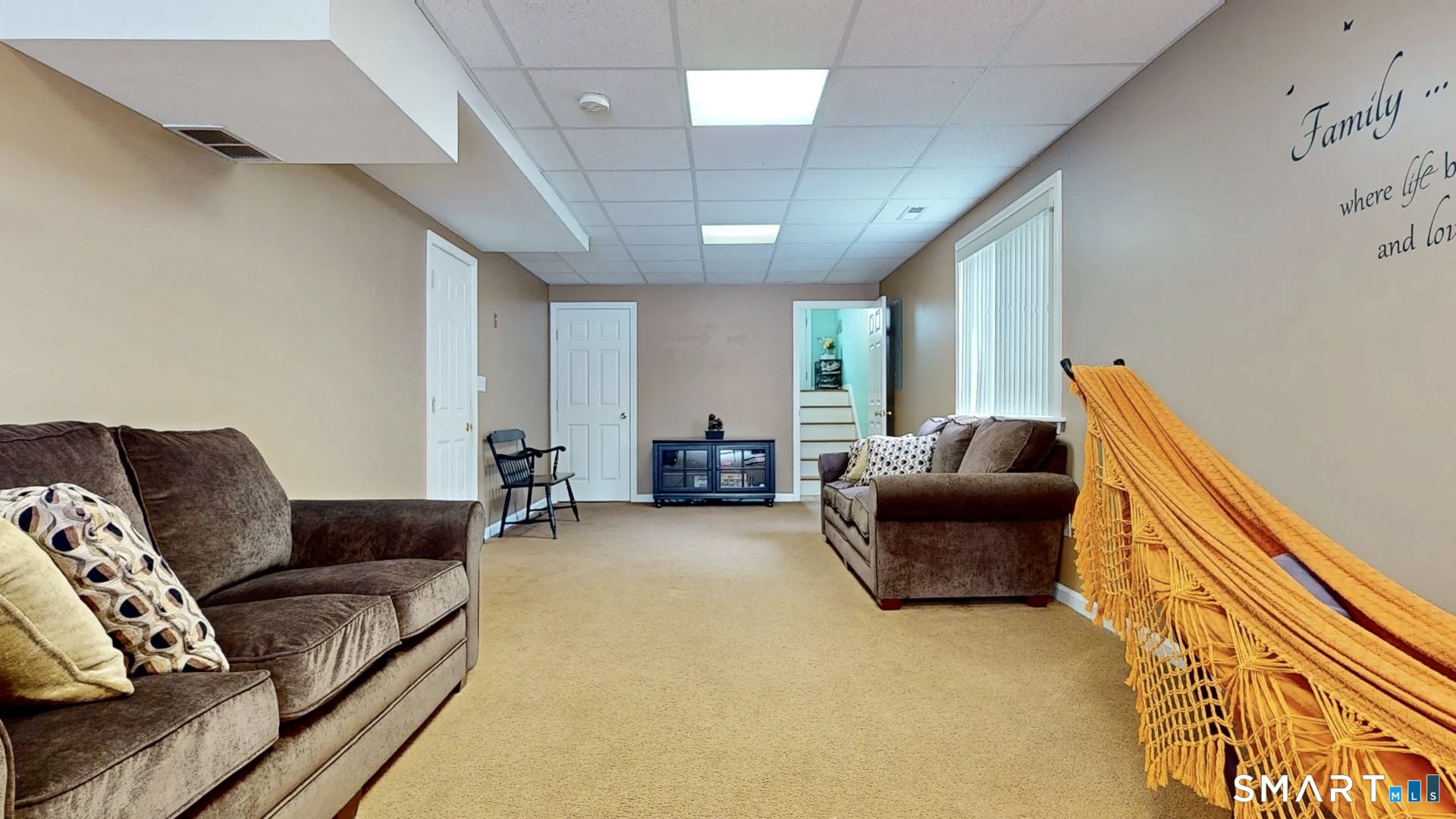 24 Mathew Street Milford, CT 06460 - Photo 16 of 20 a living room with furniture and a flat screen tv