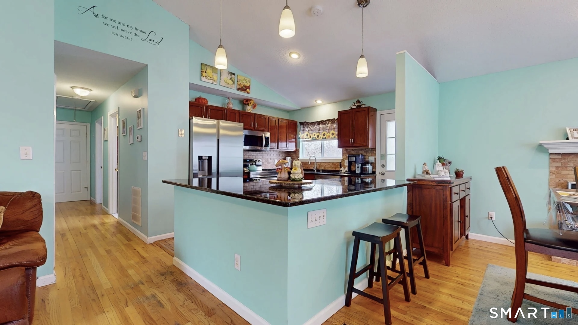 24 Mathew Street Milford, CT 06460 - Photo 2 of 20 a kitchen with stainless steel appliances granite countertop a table chairs and a refrigerator
