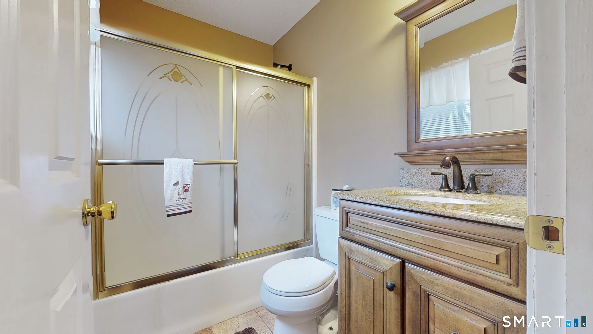 24 Mathew Street Milford, CT 06460 - Photo 10 of 20 a bathroom with a granite countertop sink toilet and shower