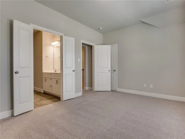 an empty room with closet area