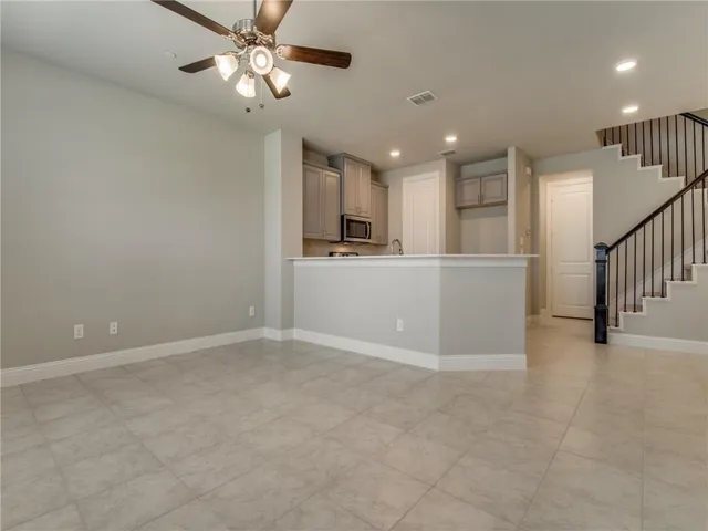 a view of a kitchen with a sink and cabinet area