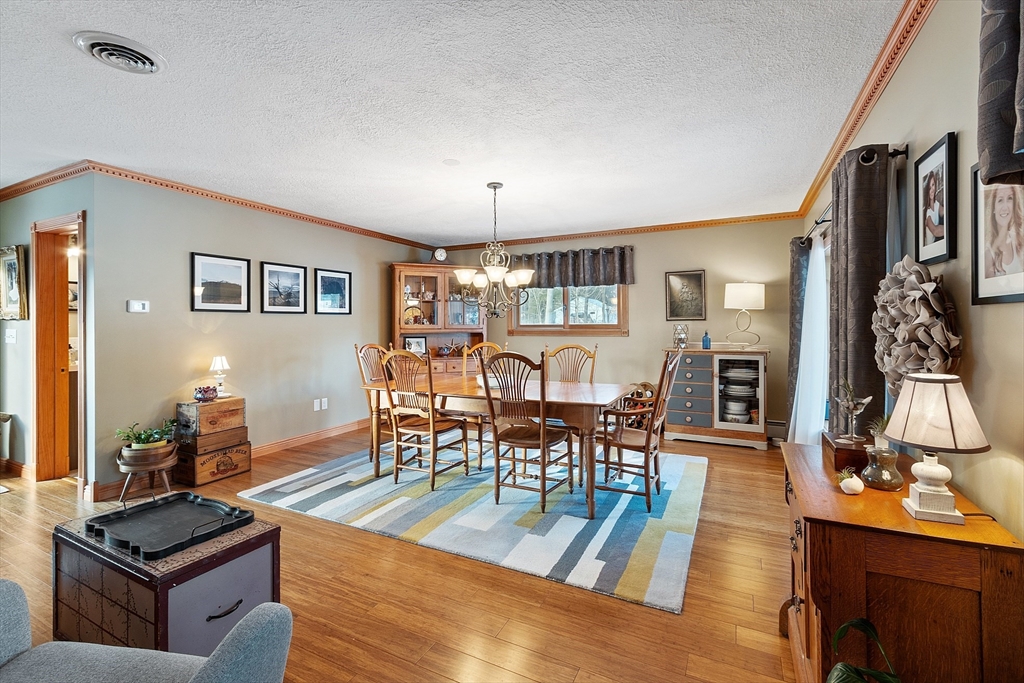5 Spaulding Hill Road Pelham, NH 03076 - Photo 20 of 40 a view of a dining room with furniture and wooden floor
