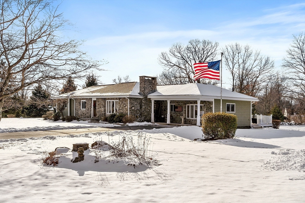 5 Spaulding Hill Road Pelham, NH 03076 - Photo 5 of 40 a front view of a house with a terrace