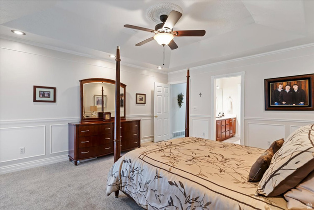 1924 North 2000th Street East Layton, UT 84040 - Photo 21 of 41 Bedroom with a decorative wall, a wainscoted wall, light carpet, a ceiling fan, and ornamental molding