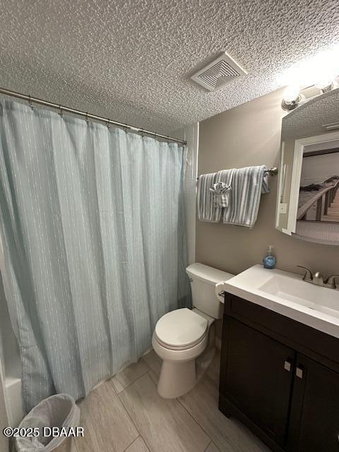 2700 Ocean Shore Boulevard, Unit 301 Ormond Beach, FL 32176 - Photo 11 of 42 a bathroom with a sink a toilet and shower curtain