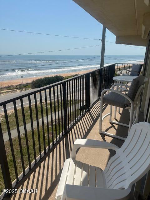 2700 Ocean Shore Boulevard, Unit 301 Ormond Beach, FL 32176 - Photo 13 of 42 a balcony with table and chairs