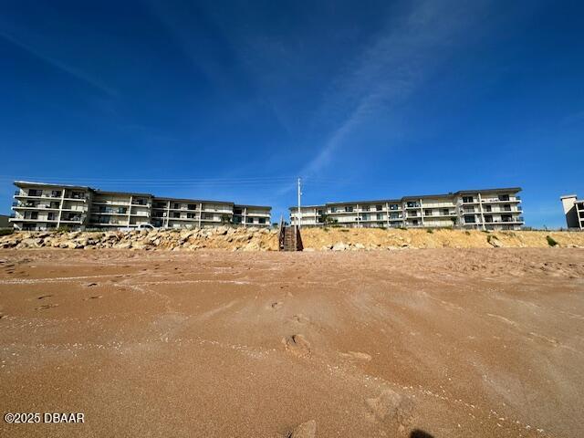 2700 Ocean Shore Boulevard, Unit 301 Ormond Beach, FL 32176 - Photo 16 of 42 a view of a building with an outdoor space