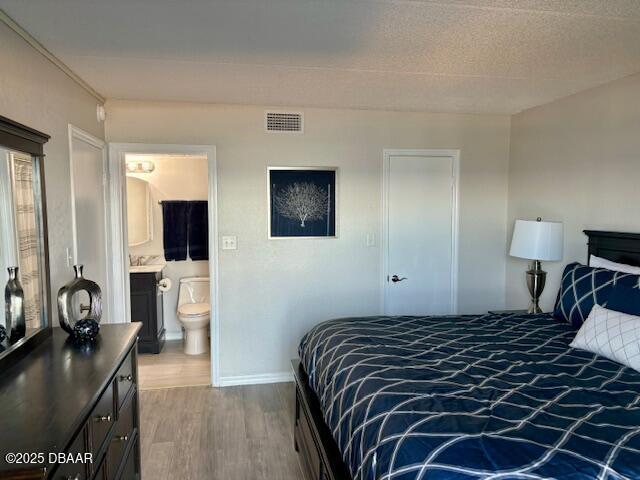 2700 Ocean Shore Boulevard, Unit 301 Ormond Beach, FL 32176 - Photo 19 of 42 a bedroom with a bed and a flat screen tv