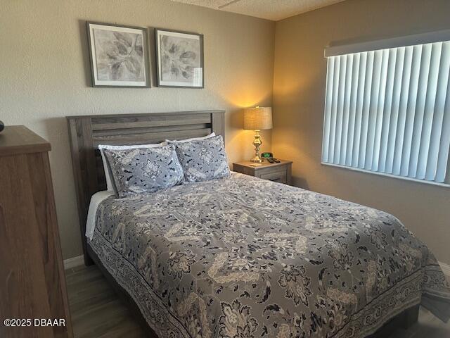 2700 Ocean Shore Boulevard, Unit 301 Ormond Beach, FL 32176 - Photo 30 of 42 a bedroom with a bed and a night stand