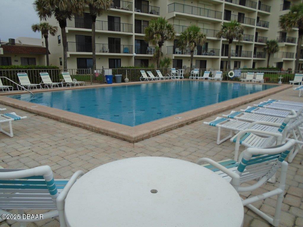 2700 Ocean Shore Boulevard, Unit 301 Ormond Beach, FL 32176 - Photo 36 of 42 a view of a swimming pool with outdoor seating