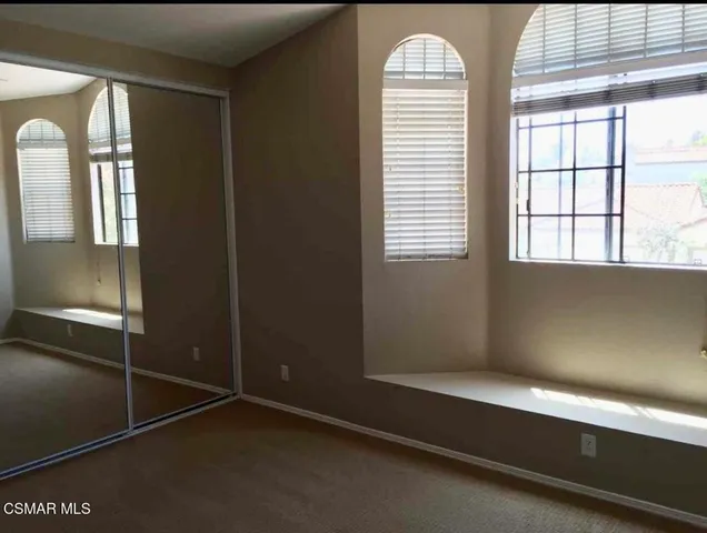 a room with window and a chandelier