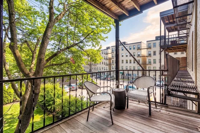 a view of balcony with furniture