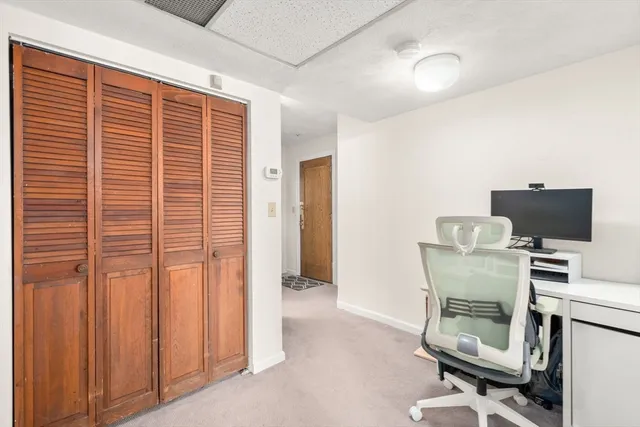 a workspace with furniture and a window