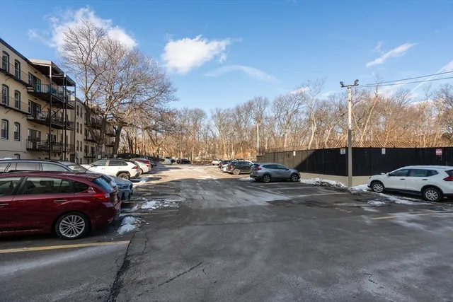 a view of street with parked cars