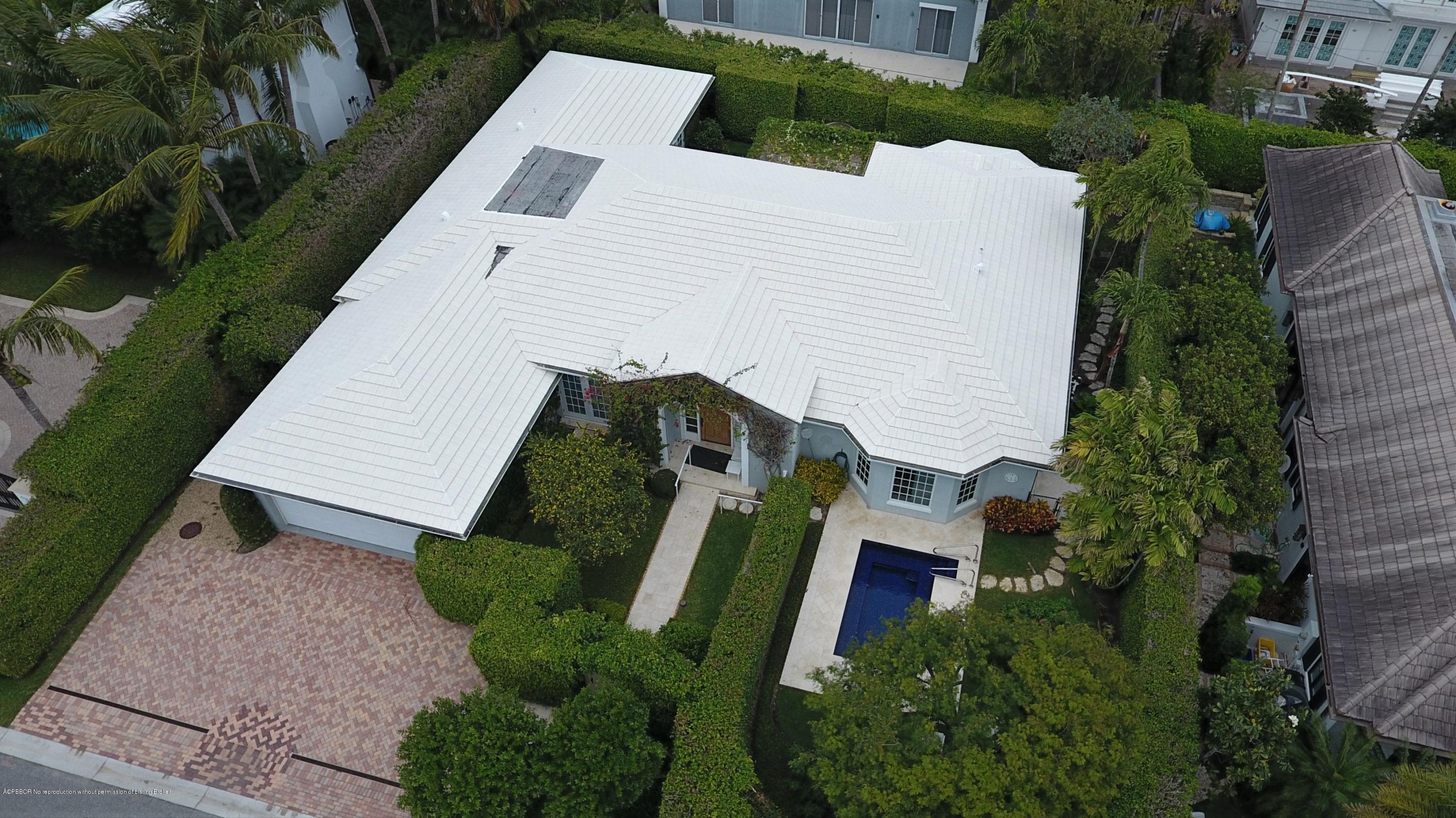 255 Ridgeview Drive Palm Beach, FL 33480 - Photo 16 of 20 an aerial view of a house with a yard and potted plants
