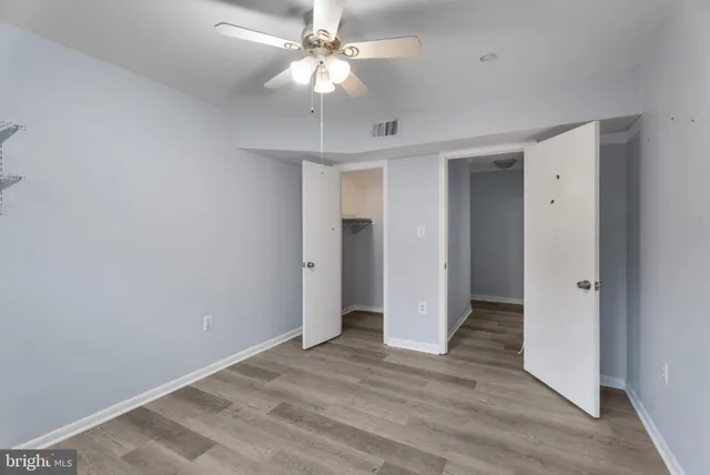 a bathroom with a bathtub shower sink vanity and toilet