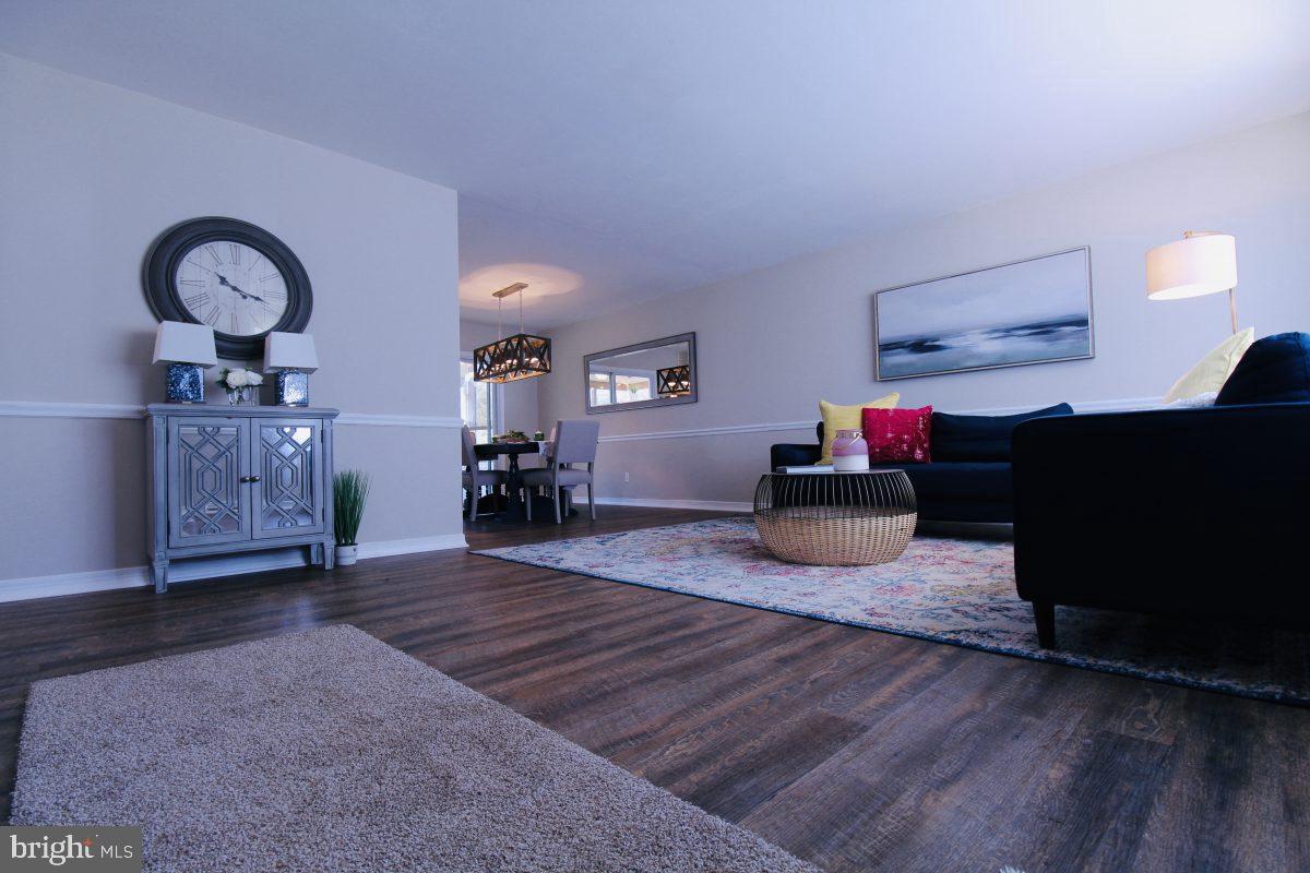 388 Nimitz Road Dover, DE 19901 - Photo 1 of 25 a living room with furniture and a mirror