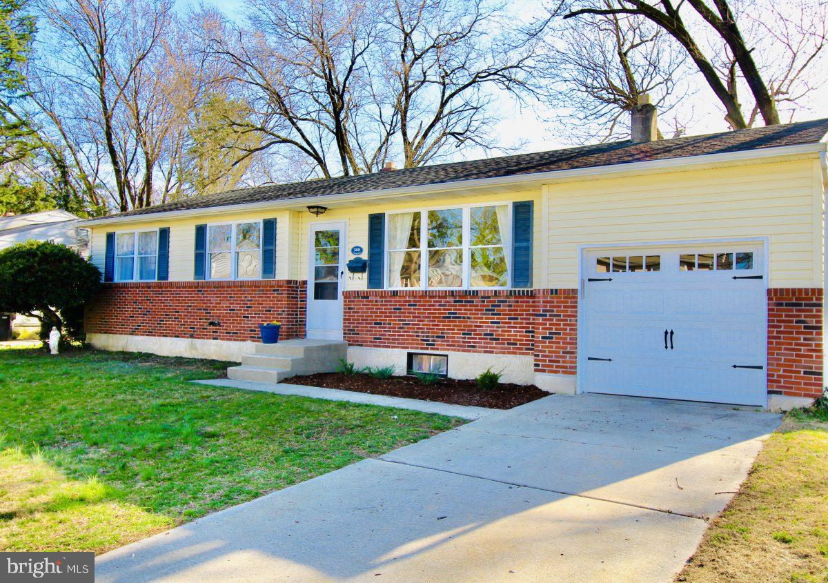 388 Nimitz Road Dover, DE 19901 - Photo 2 of 25 a front view of a house with a yard and garage