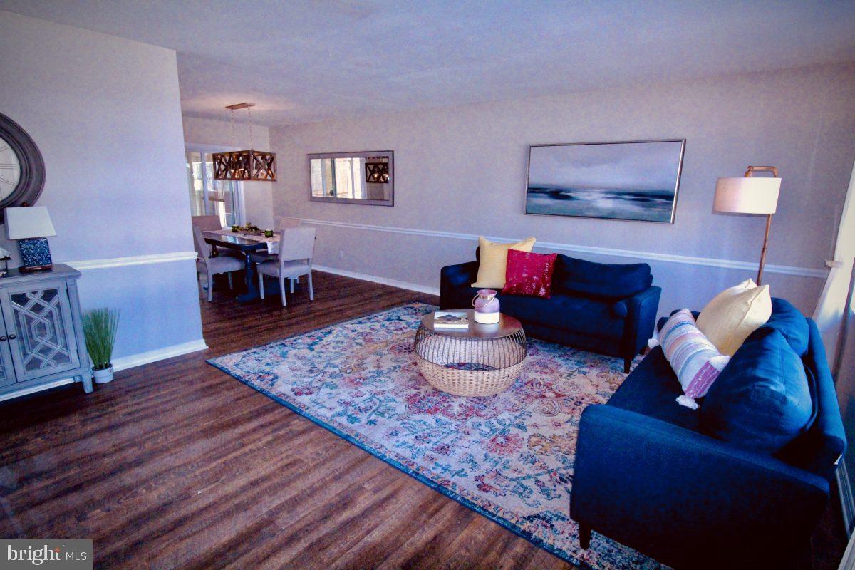 388 Nimitz Road Dover, DE 19901 - Photo 17 of 25 a living room with furniture and wooden floor