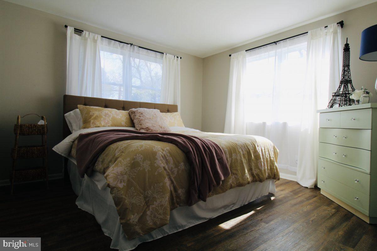 388 Nimitz Road Dover, DE 19901 - Photo 18 of 25 a bed sitting in a bedroom next to a window