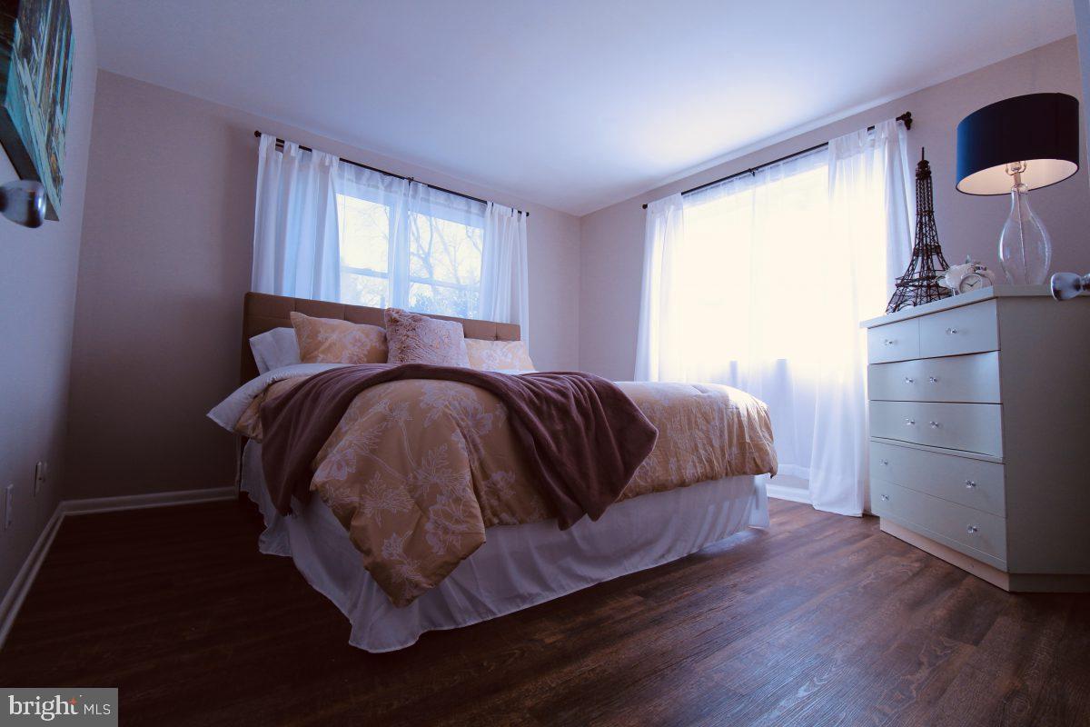 388 Nimitz Road Dover, DE 19901 - Photo 19 of 25 a bed sitting in a bedroom next to a window