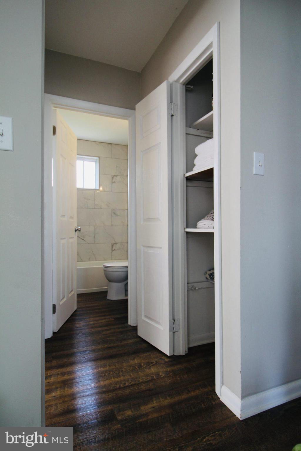 388 Nimitz Road Dover, DE 19901 - Photo 21 of 25 a view of a hallway with wooden floor and a room