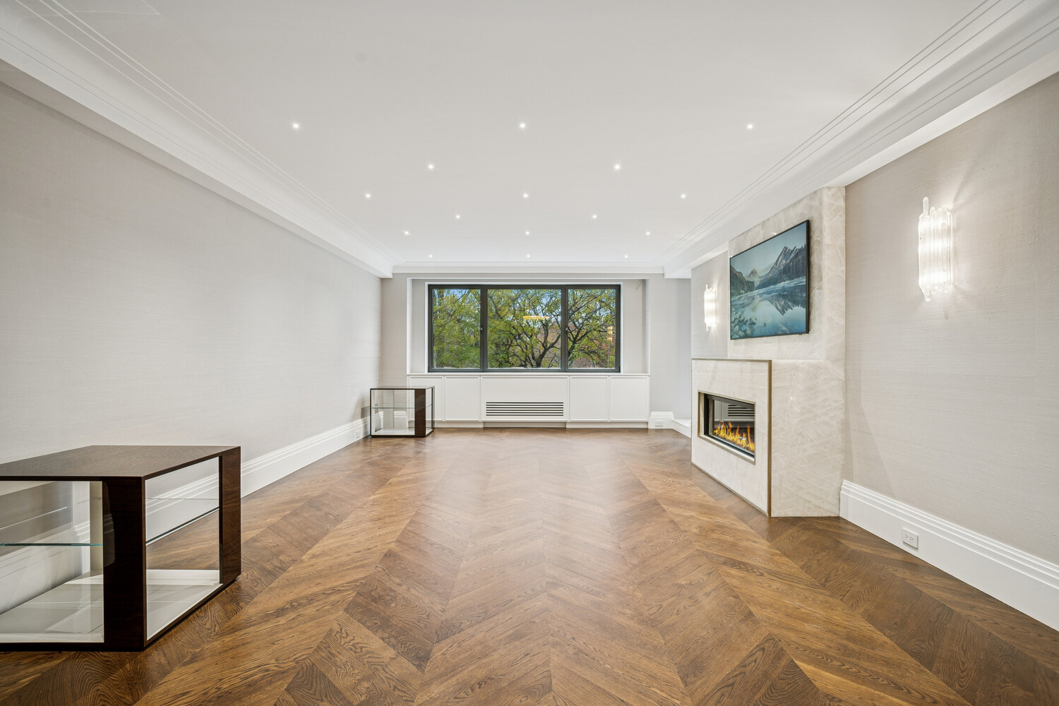 a view of a livingroom with an empty space and a fireplace