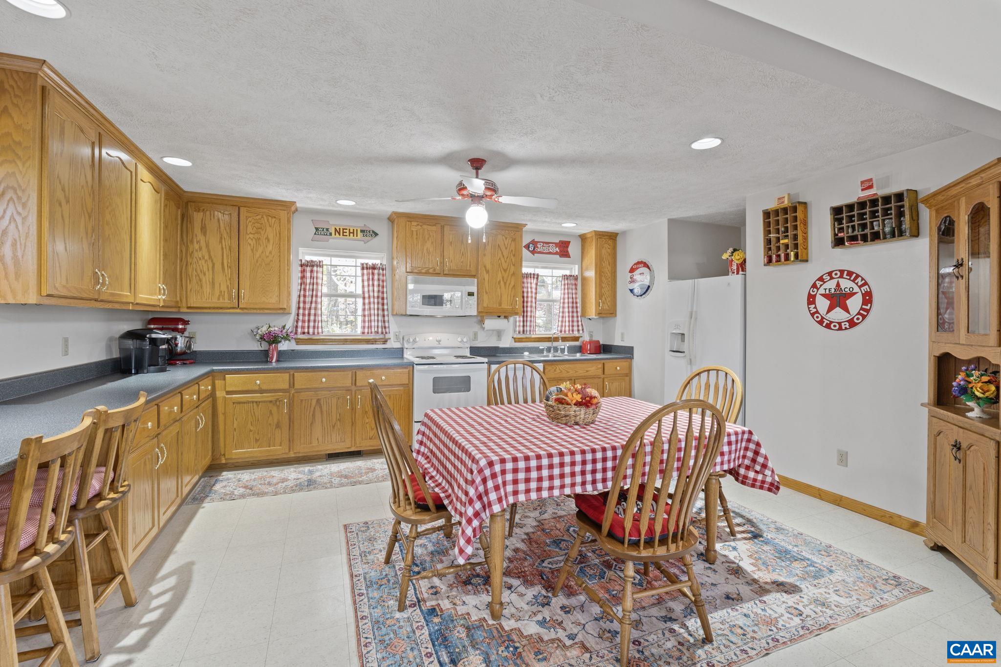 60 Chippewa Lane Palmyra, VA 22963 - Photo 17 of 69 a large kitchen with stainless steel appliances granite countertop a stove a sink a dining table and chairs