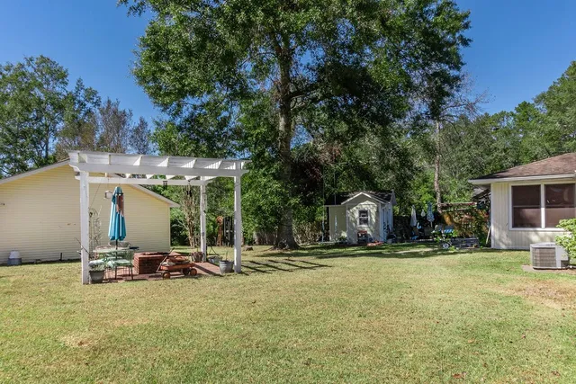 a view of a patio with a yard