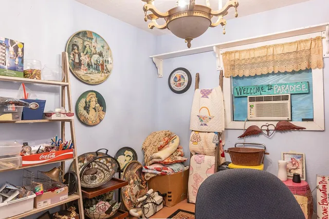 a table and a clock on a table in a room