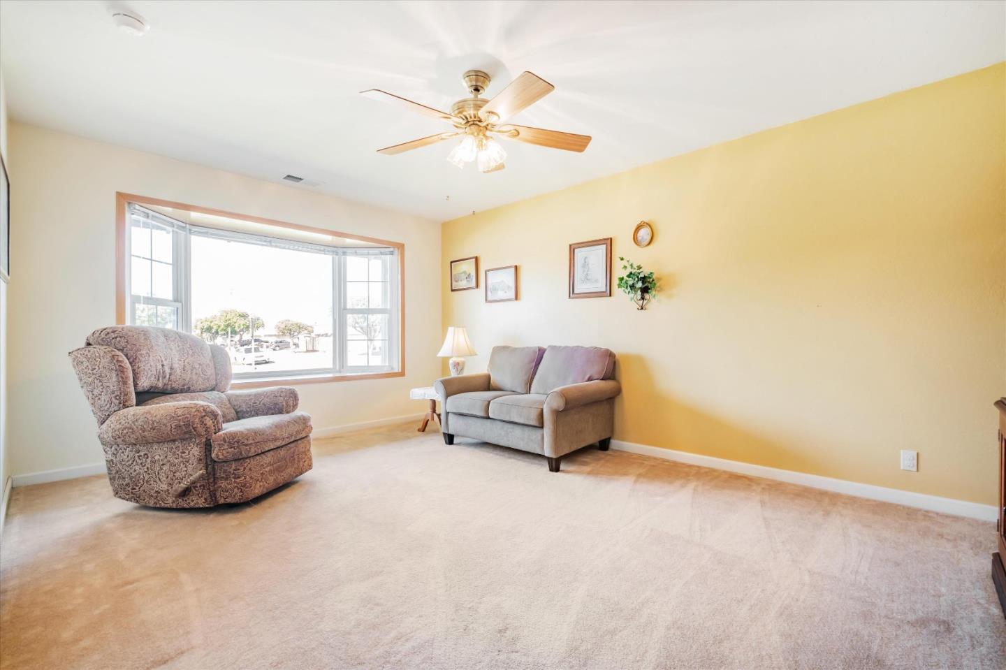 6195 Rockrose Drive Newark, CA 94560 - Photo 12 of 24 a living room with furniture and a large window