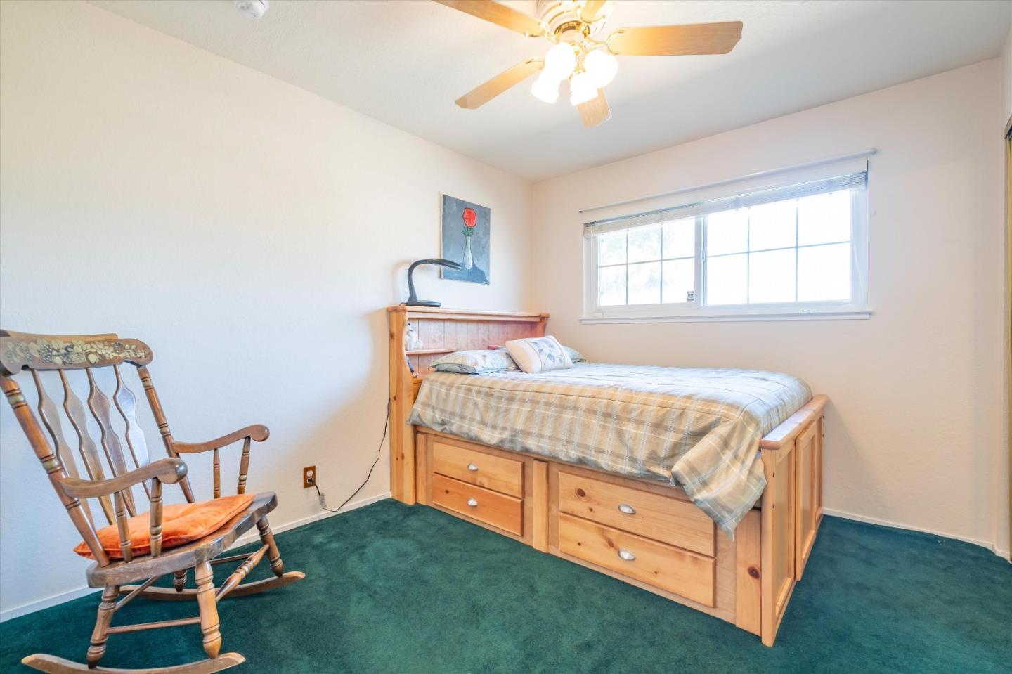 6195 Rockrose Drive Newark, CA 94560 - Photo 13 of 24 a bedroom with a bed and a chandelier