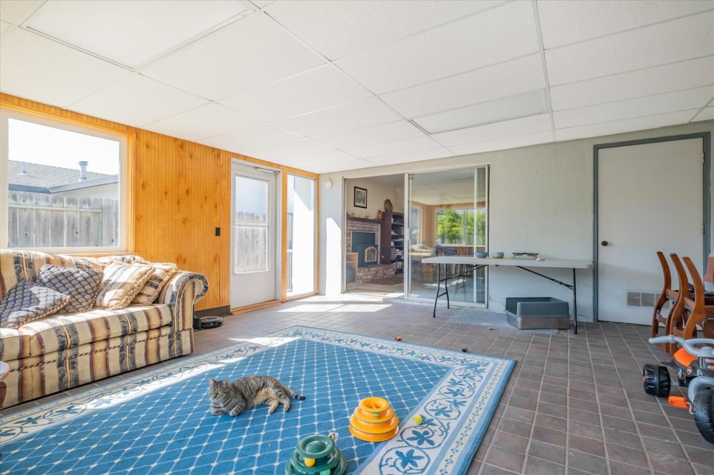 6195 Rockrose Drive Newark, CA 94560 - Photo 16 of 24 a living room with furniture and a floor to ceiling window