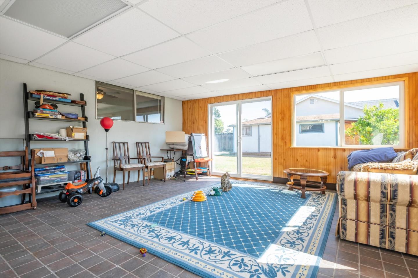 6195 Rockrose Drive Newark, CA 94560 - Photo 17 of 24 a living room with furniture a table and large window