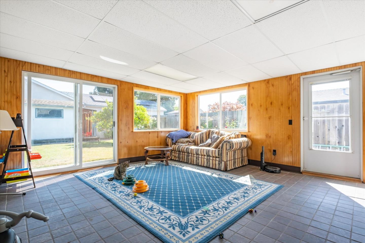 6195 Rockrose Drive Newark, CA 94560 - Photo 18 of 24 a living room with furniture and a floor to ceiling window